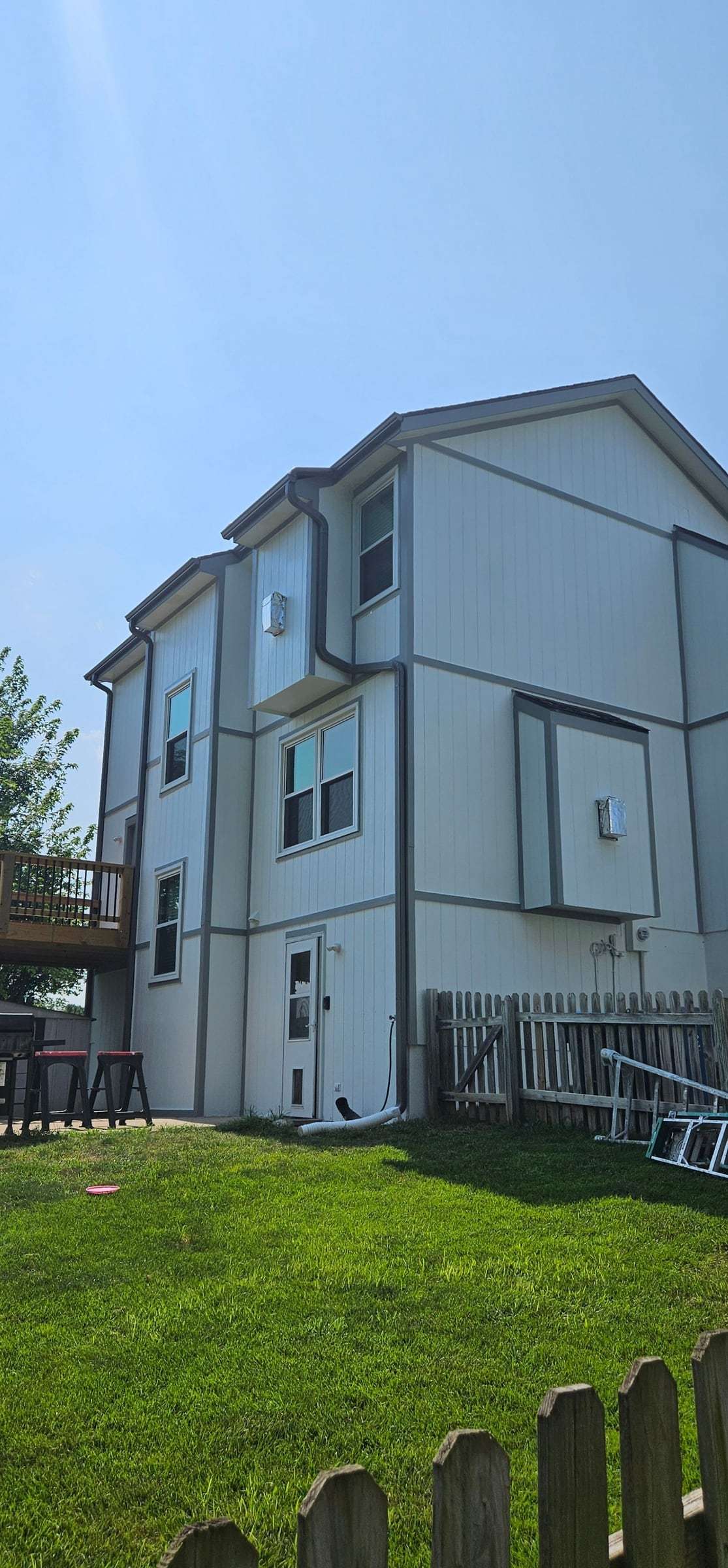 After: light gray siding with darker gray trim